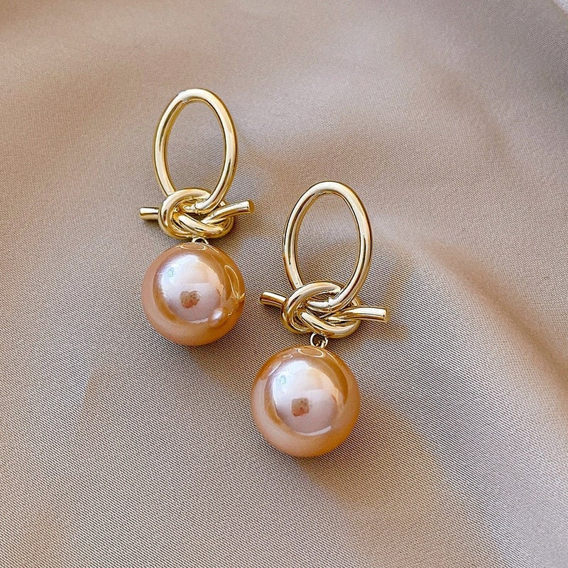 Orelhas de Pérola em Ouro